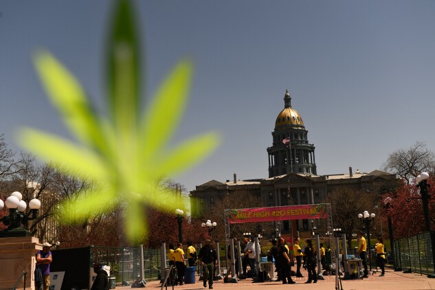 Cannabis activists rally in front of the Colorado state capitol in 2022. 